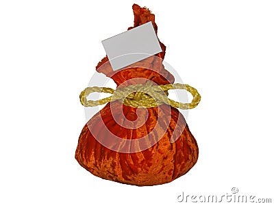 Festive orange colored gift bag tied with gold rope isolated on white background Stock Photo