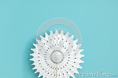 Festive party background with white paper circle fans over blue pastel backdrop Stock Photo