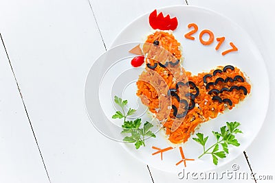 Festive salad shaped rooster or symbol of New Year 2017 on Stock Photo