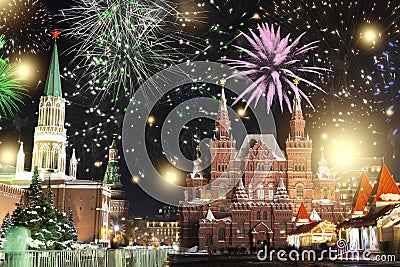 Festive salute and fireworks on the red square in Moscow. Salute lights over the Kremlin and GUM at the New Year celebration Stock Photo