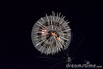 Festive salute in night sky. Explosions of fireworks and pyrotechnics in the sky Stock Photo