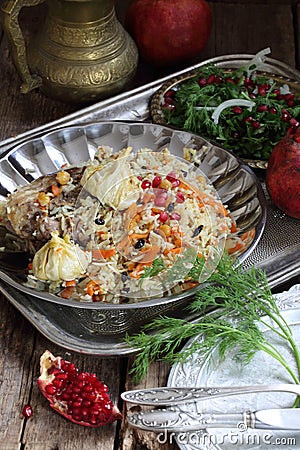 Festive table awaits Uzbek pilaf with meat and chickpeas Stock Photo