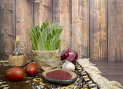 Festive table in honor of Navruz. Wheat with a red ribbon, the traditional holiday of the vernal equinox Nawruz Stock Photo