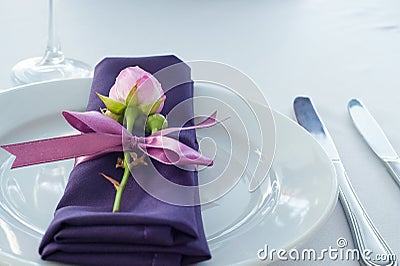 Festive table setting in the restaurant with flowers. Stock Photo