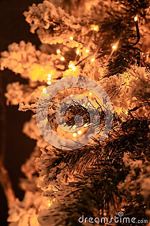 White Flocked Christmas Tree with Lights Stock Photo