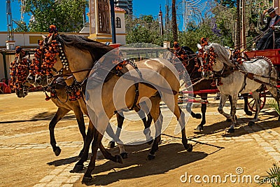 A festively decorated 5-horse cart trotting at the Horse Feria Feria de Caballo , Jerez de la Frontera, Andalusia, Spain, May 14 Editorial Stock Photo