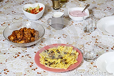 Festively laid Shabbat table with delicious dishes. Stock Photo