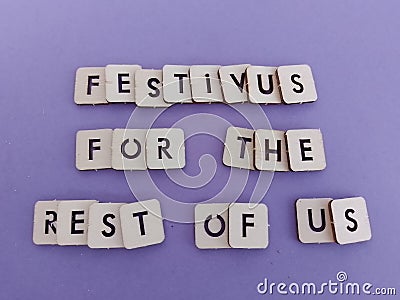 Festivus for the rest of us message on wood blocks on a purple background Stock Photo