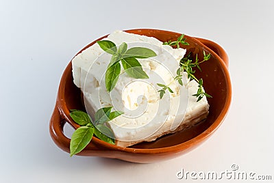 Feta cheese on brown plate Stock Photo