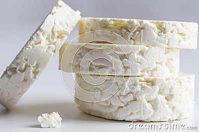 Feta cheese disk stack on white background Stock Photo