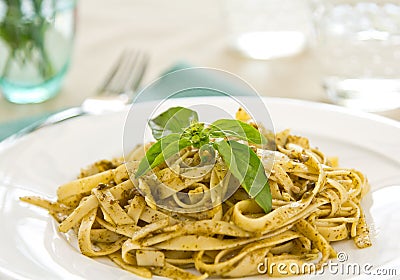 Fettuccine with pesto Stock Photo