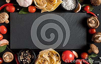 Fettuccine tagliatelle paste with herbs and spices with slate bo Stock Photo