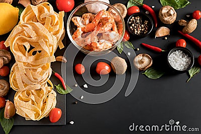 Fettuccine tagliatelle paste with prawns shrimps, herbs, spices Stock Photo