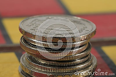 A few CHF coins in a pile on the chessboard Stock Photo
