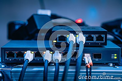 Few ethernet cables connected to a network device Stock Photo