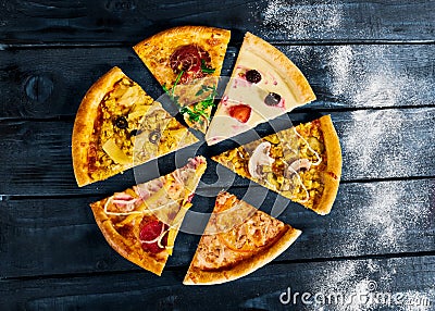 A few pieces of pizza on a gray background Stock Photo