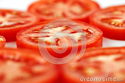 A few slices of organic vine tomatoes shot Stock Photo