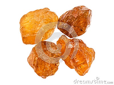 few unpolished hessonite crystals isolated Stock Photo