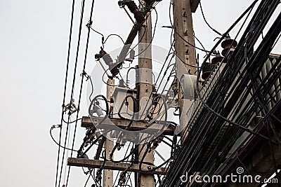 Few utility poles, complicated wires and a lot of telephone cables Stock Photo