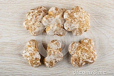 Few whole gingerbreads, broken gingerbread on table. Top view Stock Photo