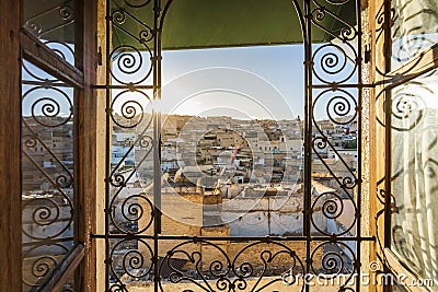 Fez medina seen through decorated in arabic style window, Morocco, North africa Editorial Stock Photo