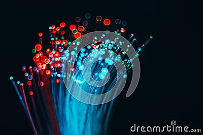 Fiber optical network cable and blurred light for background and Stock Photo