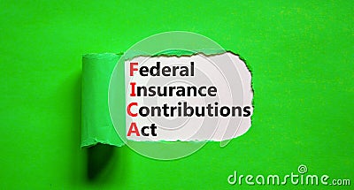 FICA symbol. Concept words FICA federal insurance contributions act on white paper on beautiful green background. Business FICA Stock Photo