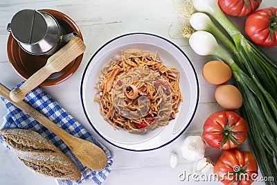 Fideua with squid and seafood. Typical Spanish tapa cooked with paella. Stock Photo