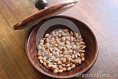 Field bean or hyacinth bean in wooden bowl Stock Photo