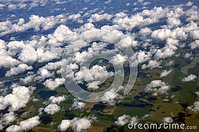 Field dotted with clouds Stock Photo