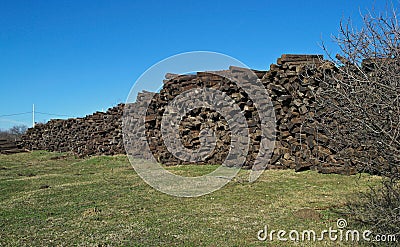 Field with giant pile of railway cross ties Stock Photo