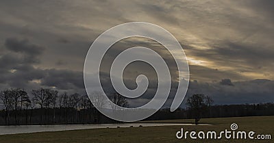 Field and hills near Hreben pond village in cloudy day in south Bohemia Stock Photo