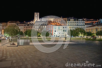 field of onions at night with facade of Casa dos Becos and SÃ© in Lisbon. Stock Photo