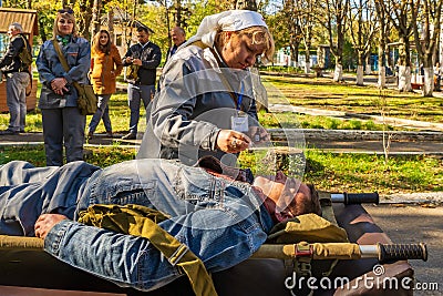 The field paramedic gives the patient ammonia. Editorial news background. October 11, 2022 Balti Moldova Editorial Stock Photo