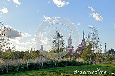 Field and trees with the Moscow Kremlin Stock Photo
