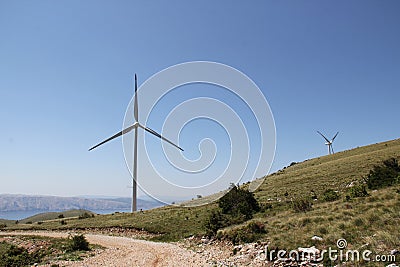 Field of wind turbines for production of electricity. Stock Photo