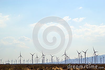 Field of windmills along the desert landscape Stock Photo