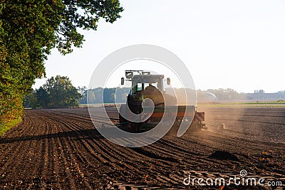 A Field work with the tractor on the field Stock Photo