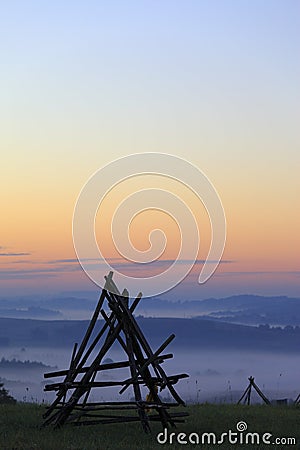 Fields and meadows under early morning fog in Podkarpacie region, Poland. Stock Photo