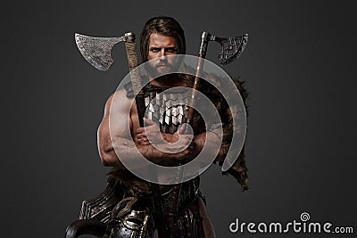 A fierce bearded Viking warrior in fur and light armor Stock Photo