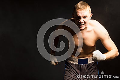 Fierce determined young boxer Stock Photo