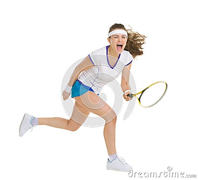 Fierce tennis player hitting ball Stock Photo