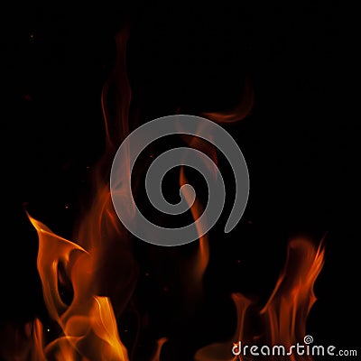 Fiery flame with sparks on a black background. Texture element for barbecue or cooking Stock Photo