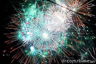 fiery sparks from huge fireworks during night celebrations Stock Photo