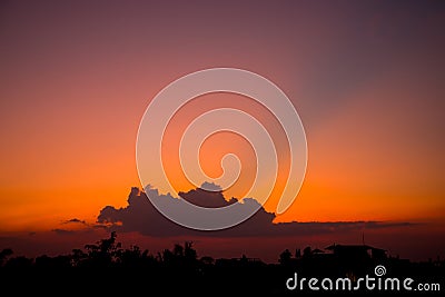 Fiery sunset with darkness forceground in asia. Siem reap city, Cambodia Stock Photo