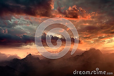 Fiery sunset and hazy mountain peaks Stock Photo