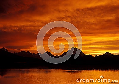 Fiery Sunset Over Teton Stock Photo