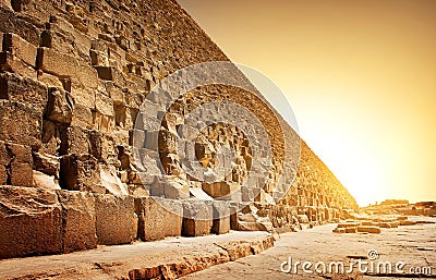 Fiery sunset and pyramid Stock Photo