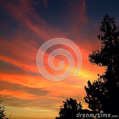 Fiery Sunset Streaks Stock Photo