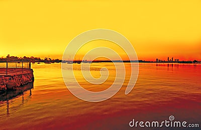 Fiery sunset on swan river with jetty-perth Stock Photo